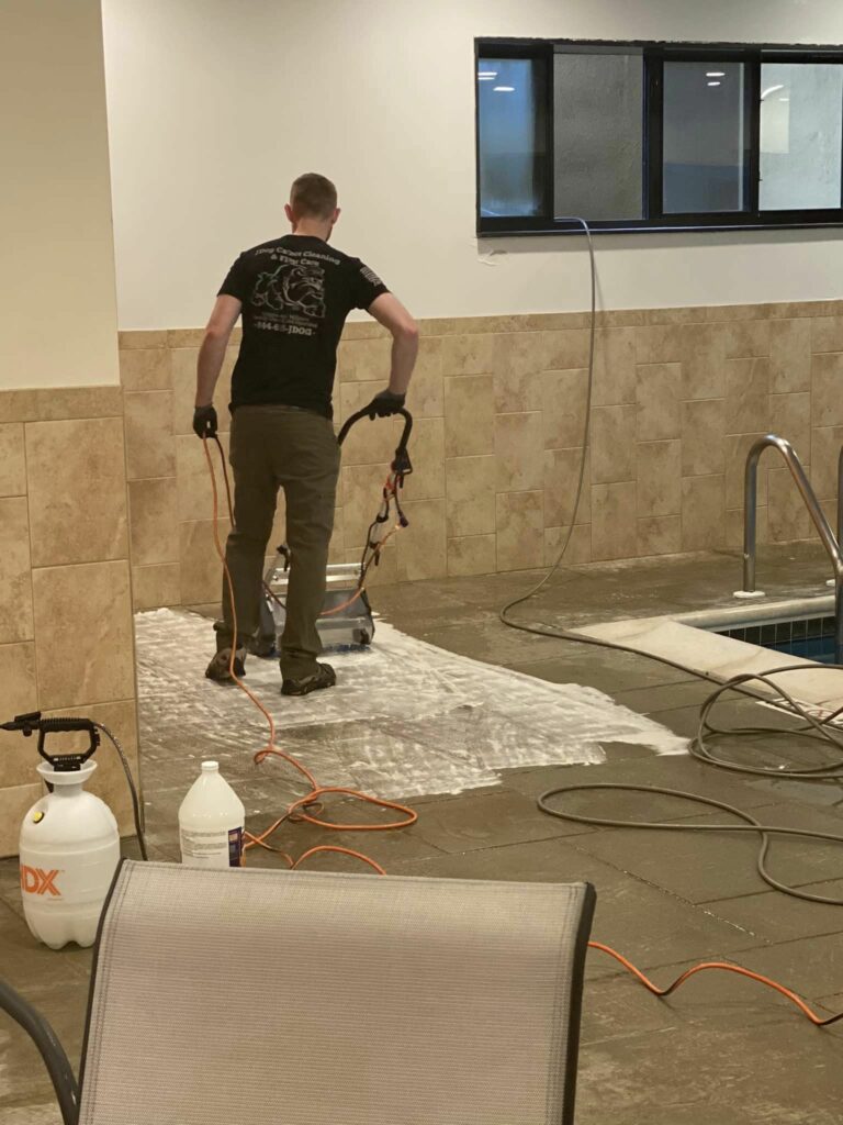 A professional who is cleaning a floor and works for a hardwood cleaning company in Collegeville, PA